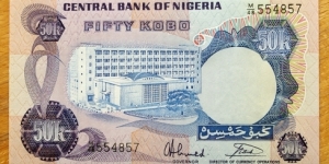 Nigeria | 
50 Kobo, 1973-1978 | 

Obverse: Central Bank building in Lagos | 
Reverse: Log cutters and Coat of arms | 
Watermark: Heraldic eagle | Banknote