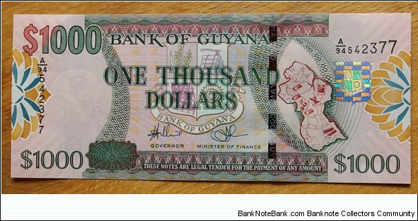 Guyana |
1,000 Dollars, 2009 |

Obverse: Coat of Arms and Map of Guyana |
Reverse: Bank of Guyana building |
Watermark: Head of a Macaw parrot Banknote