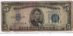 US Five Dollar Silver Certificate - Series 1934B.
Someone spent this neat note for raffle tickets at the 2005 Ocala Coin Show. Since I was on the desk the next morning, I got first crack at it. Banknote