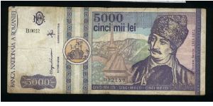 5000 Lei.

Round yellow seal at left (March 1992).

Avram Iancu and church on face; church, the gate of Alba Iulia stronghold and gray seal on back.

Pick #103 Banknote