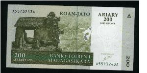 1000 Francs=200 Ariary.

Primitive village on face; ancient religious temple on back.

Pick #new Banknote