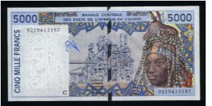 5000 Francs.

Serial -C- prefix (Burkina Faso).

Woman wearing headdress adorned with cowrie shells and smelting plant on face; women with children and various pottery on back.

Pick #313C-a Banknote