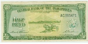 Philippines Commonwealth (Central Bank )First Fifty centavos issue. The ONLY note with reference to half/peso and 50 Centavos on the same note. ALSO, Note the strong U.S.influence..THIS NOTE IS LEGAL TENDER IN THE PHILIPPINES FOR ALL DEBTS PUBLIC AND PRIVATE. Mount Pinatubo in the background erupted in July 1991(3rd most conical-shaped mountain in the world)which hastened the departure of American presence in the Philippines, as ALL U.S Bases were abandoned. These included Subic Bay in Alongapo Banknote