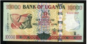 10,000 Shillings.

Musical instruments at left on face; Owen Falls dam, kudu on back.

Pick #NEW Banknote