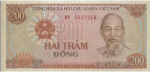 200 Dong Dated 1987.(O)Ho Chi Minh(R)Field workers & Tractor. Banknote