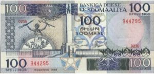 100 Shilin Dated 1989,Central Bank Of Somalia(O) Dagathur Monument(R)Factory. Banknote