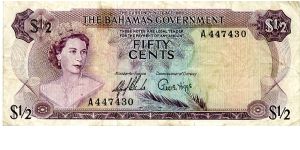 Bahamas Goverment
$1/2  1965
Multi Minister of Finance 
Commissioner of Currency G Higgs
Front Value in corneres QEII, 
Rev Yellow elders, Straw market, Coat of Arms
Watermark Banknote