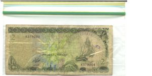 Dark olive-green on multicolour underprint. Shoreline village on back. Banknote