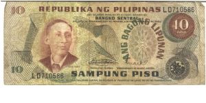 Like #144, 149

Brown on multiclour underpint. A. Mabini at left and as watermark. Barasaoain Church on back.

Central Bank Seal Type 2. Overprint: ANG BAGONG LIPUNAN on watermark area, 1974-1985.

Signature 8 Banknote