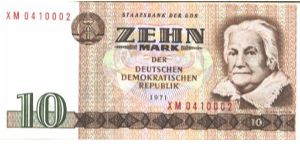 East Germany

Brown on multicolour underprint. Clara Zetkin at right. Woman at radio station on back. Banknote