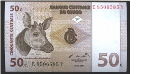 Dark brown and brown on multicolour underpront. Okapi's head at left. Family of Okapis at left center on back.

Printer: G&D Banknote