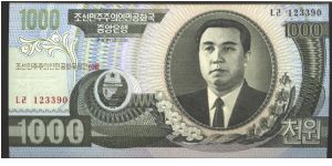 Like #243

Dark green on multicolour underprint. Back slate blue on multivolour underprint.

Arms at lower left center. Kim Il Sung at right. Rural home at center on back.

Watermark: Arched Gateway Banknote