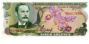 5 Colones 
Multi
Series D
Rafael Yglesias Castro & National Flower - The Guaria Morada (Cattleya skinneri), a Purple orchid 
scene of Teatro Nacional in 1897 Banknote