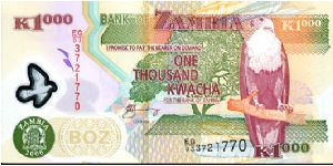 1000 Kwacha Polymer
Green/Purple
See through window above Bank seal & African Fish Eagle
Aardvark & Farmer on tractor, Chainbreaker statue Banknote