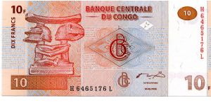 10 Francs 
Redbrown
Apui-tete Chef Luba carving of a couple 
Coupe en Bois Luba carving 
Security thread 
Wtmark Okapi? Banknote