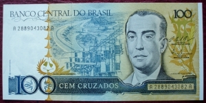 Banco Central do Brasil |
100 Cruzados |

Obverse: President Juscelino Kubitschek de Oliveira, Electric power station and Roads |
Reverse: Catetinho – the first building ever built in Brasilia, National Congress and Palácio da Alvorada – the official residence of the President of Brazil |
Watermark: Juscelino Kubitschek Banknote