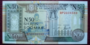 Bankiga Dhexe ee Soomaaliya |
50 New Shilin |

Obverse: Loom worker and Architectural elements |
Reverse: People with donkey and Banana trees |
Watermark: Man in a headdress (turban) Banknote
