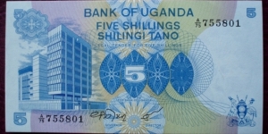 Bank of Uganda |
5 Shilingi |

Obverse: Bank of Uganda |
Reverse: Coffee bean picking Banknote