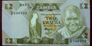 Bank of Zambia |
2 Kwacha |

Obverse: The first president of Zambia; Kenneth David Kaunda, African Fish Eagle (the national bird of Zambia), Flowers and Coat of arms |
Reverse: Teacher with student and A school building |
Watermark: Profile portrait of Kenneth Kaunda Banknote