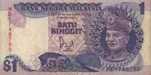  1 Ringgit  
ND (1986; 1989). Dark blue and purple on multicolor underprint. T. A. Rahman at right. Signature Datuk Jaafar Hussein. Vertical serial number. Back: National Monument Kuala Lumpurate at center. Watermark: T. A. Rahman. Printer: TDLR.
 Banknote