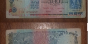 100 Rupees. Dr Manmohan Singh signature. Banknote