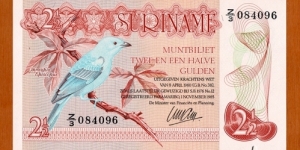 Suriname | 
2½ Gulden, 1985 | 

Obverse: A blue-grey Tanager | 
Reverse: A lizard, and A dam | Banknote
