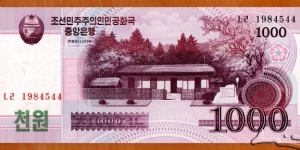 North Korea | 
1,000 Wŏn, 2008 | 

Obverse: Birthplace of Kim Il-sung's first wife and Kim Jong Il's mother, Kim Jong Suk | 
National National Coat of ArmsReverse: Lake Samji | 
Watermark: Blossoms of Siebold's Magnolia (Magnolia sieboldii) | Banknote