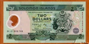 Solomon Islands | 2 Dollars, 2001 – Commemorating CBSI Silver Jubilee | Obverse: National Coat of Arms, Stylised Bonito fish, Food bowl with two porpoises, and Bokolo - stylised bird used as money | Reverse: Spearfishing scene | Window: Value | Banknote