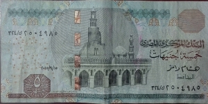 5 Egyptian Pounds 

Signature: Hisham Ramez 
Front: Ahmad Bin Tulun mosque, Cairo
Back: Frieze (Bounty of River Nile) Banknote