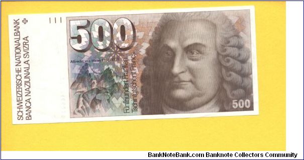 500 Franken.

Format: 181x82mm

Albrecht von Haller at right and mountains (Gemmi Pass) at left on face; anatomical muscles of the back, schematic blood circulation and a purple orchid flower on vertical format on back.


Pick #58b Banknote