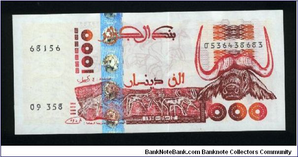 1000 Dinars.

Tassili cave carvings of animals and water's buffalo head on face; hoggar cave painting of antelope and ruins on back.

Pick #142 Banknote