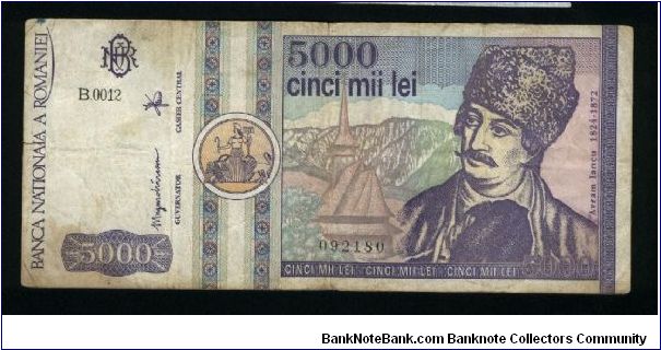 5000 Lei.

Round yellow seal at left (March 1992).

Avram Iancu and church on face; church, the gate of Alba Iulia stronghold and gray seal on back.

Pick #103 Banknote