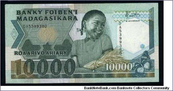 10000 Francs=2000 Ariary.

Young girl with sheaf on face; harvesting rice on back.

Pick #74 Banknote