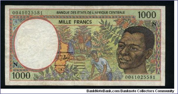 1000 Francs.

Serial -N- prefix (Equatorial Guinea).

Young man at right, harvesting coffee beans at center on face; forest harvesting, Okoume raft and Bakele wood mask on back.

Pick #502N-g Banknote