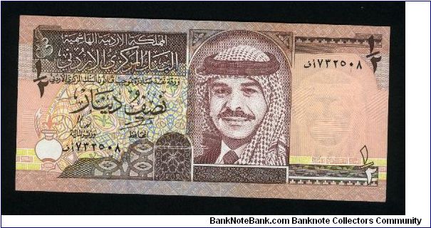 1/2 Dinar.

King Hussein wearing headdress at center on face; Qusayr Amra fortress on back.

Pick #28b Banknote