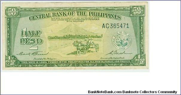 Philippines Commonwealth (Central Bank )First Fifty centavos issue. The ONLY note with reference to half/peso and 50 Centavos on the same note. ALSO, Note the strong U.S.influence..THIS NOTE IS LEGAL TENDER IN THE PHILIPPINES FOR ALL DEBTS PUBLIC AND PRIVATE. Mount Pinatubo in the background erupted in July 1991(3rd most conical-shaped mountain in the world)which hastened the departure of American presence in the Philippines, as ALL U.S Bases were abandoned. These included Subic Bay in Alongapo Banknote