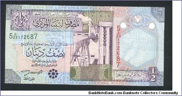 1/2 Dinar.

Oil refinery at left center on face; irrigation system at left center on back.

Pick #63 Banknote