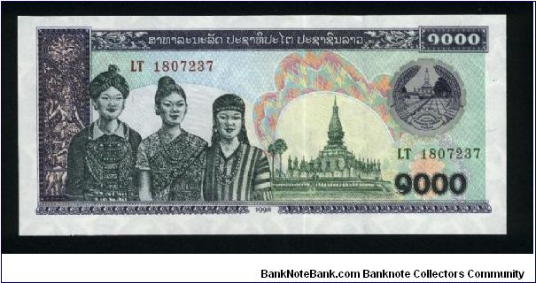 1000 Kip.

Three women at left, temple at center right, arms at upper right on face; cattle at center on back.

Pick #32e Banknote