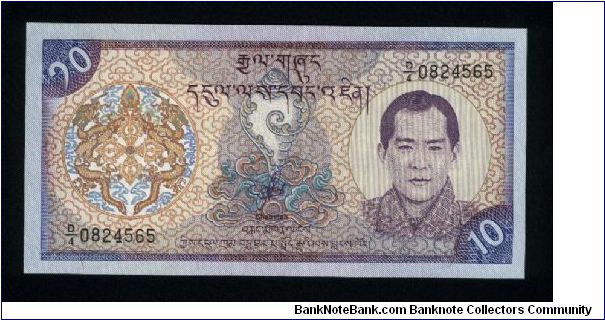 10 Ngultrum.

Portrait King Jigme Singye Wangchuk at right on face; Paro Dzong palace at center on back.

Pick #22 Banknote