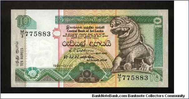 10 Rupees.

Sinhalese Chinze at right on face; painted stork at top left, Presidential Secretariat building in Colombo, flowers in lower foreground on back.

Pick #102 Banknote