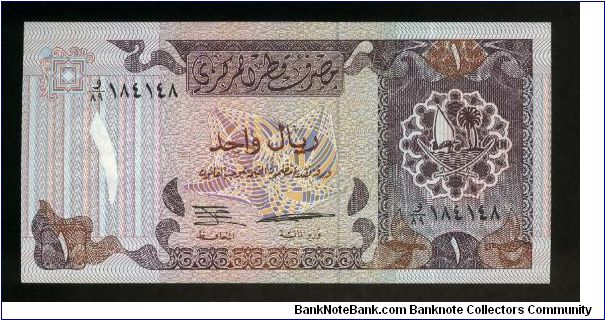 1 Riyal.

Arms at right on face; boat beached at left, Ministry of Finance, Emir's Palace in background at center on back.

Pick #14a Banknote