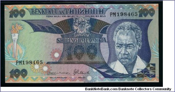 100 Shilingi.

Portrait of an older President J. Nyerere at right, torch at left, arms at center on face; graduation procession on back.

Pick #14b Banknote
