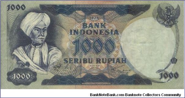 1000 RUPIAH. SIGNED BY DRS.RACHMAT SALEH,SOEKSMONO B.MARTOKOESOEMO. (O)PANGERAN DIPONEGORO (R)A FARMER PLOUGHING IN THE RICEFIELD. WATERMARK MAJAPAHIT STATUE. 158X79MM Banknote