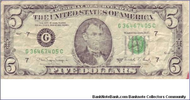 USA $5 notes from Series 1988.

This not is in a very bad circulated condition, the back isn't too bad but Lincoln's face on the front has lost it's detail, there's also a red pen mark on the bottom right hand side.

I was given this note in 1989 and had it my wallet for years as it was something different to a UK note Banknote