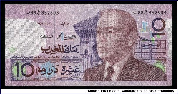 10 Dirhams.

Older bust of King Hassan II at right on face; musical instruments and pillar at left on back.

Pick #63b Banknote