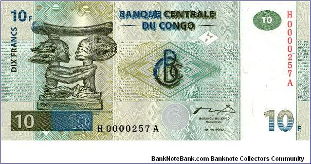 Headrest on front; carved wooden statue on back Banknote