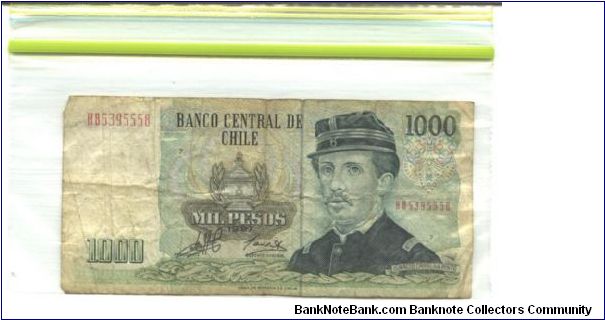 Deep blue-green, dark olive-brown on multicolour underprint. Ignacio pinto at right and as watermark, military arms at center. Monument to Chilean heroes on back. 12 signature varieties. Banknote