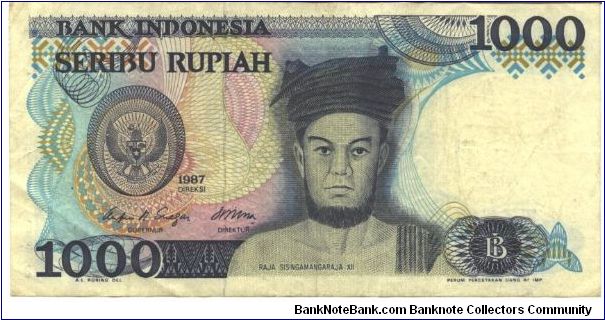 Blue-bliack on multicolour underprint. Raja Sisingamangaraja XII at center, arms at left. Yogyakarta Court at center on back. Watermark: Sultan Hasnuddin Banknote