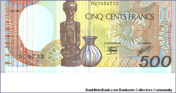 Brown on orange and multicolour underprint. Carving and jug at centr. Man carving mask at left center on back. Signature 9 Banknote