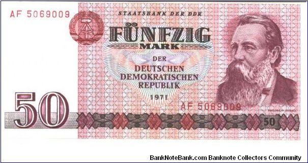 East Germany

Dark red on multicolour underprint. Friedrich Engels at right. Oil refinery on back. Banknote